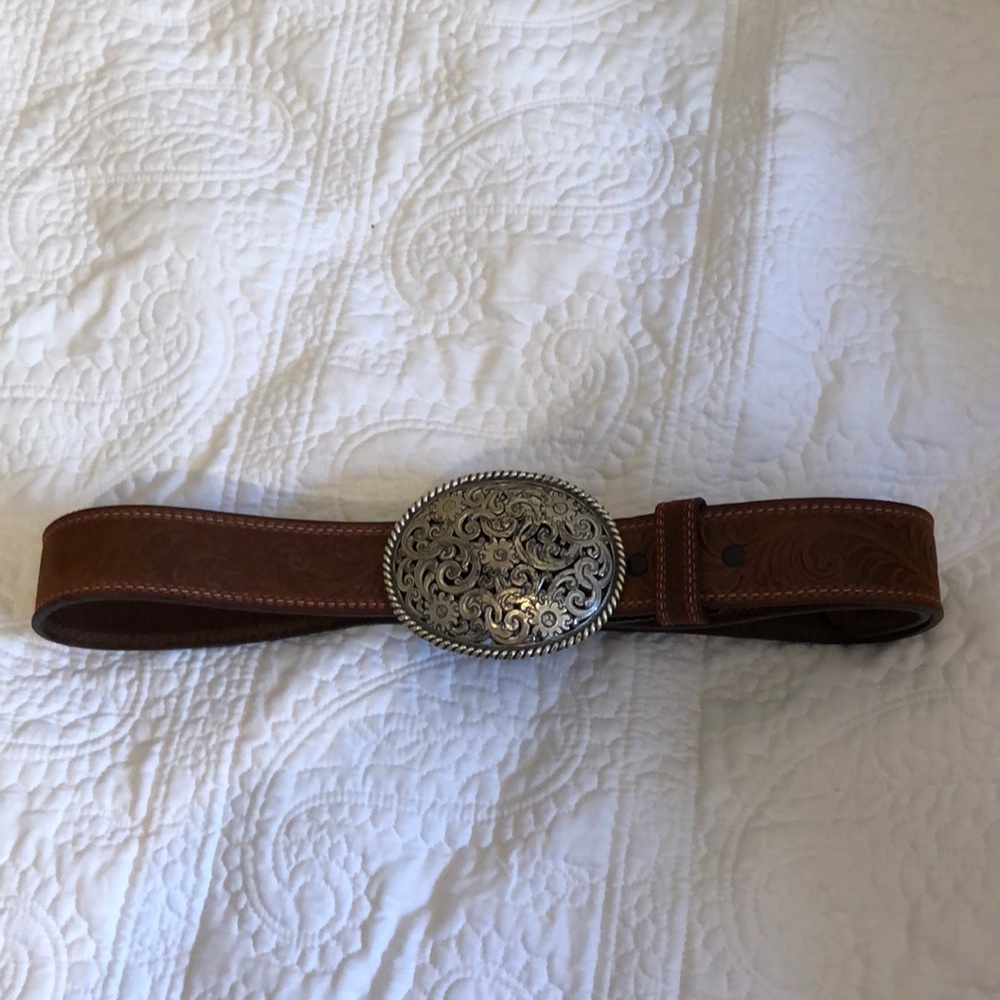 Brown leather belt with silver buckle.